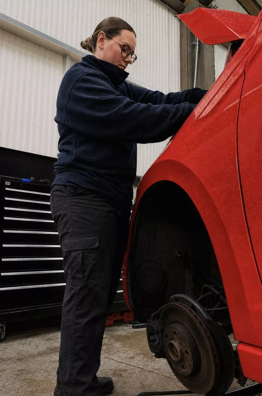 Sophie working on a vehicle
